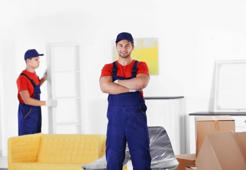 Office furniture and boxed equipment prepared for a business move