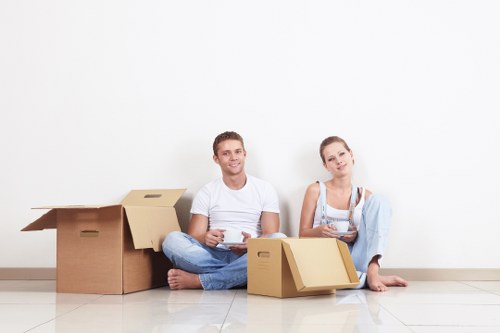 Professional team handling desks and office furniture during a Finsbury move