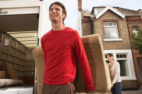 Moving furniture through a narrow Finsbury street with care