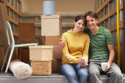 Moving team handling boxes and furniture in Finsbury