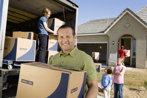 Careful loading of office furniture for removal in Finsbury