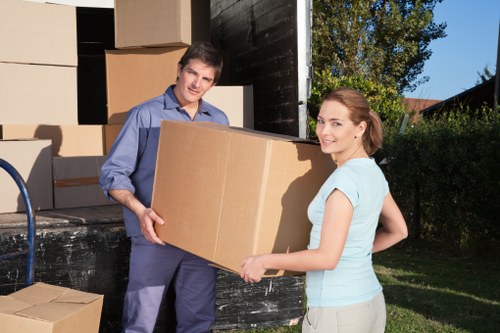 Professional movers preparing furniture for transport in Finsbury