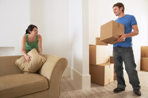 Careful loading of a piano into a removal vehicle for transport